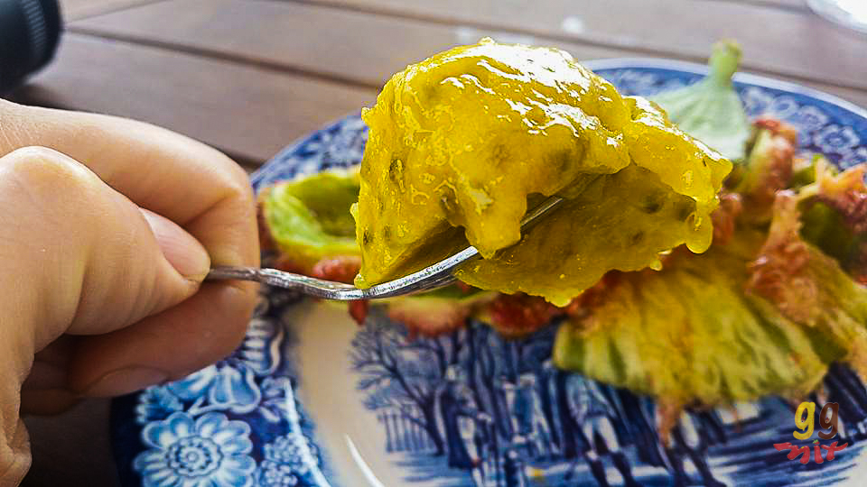 A PEELED PAPOUTSOSIKA - PRICKLY PEAR ON A FORK