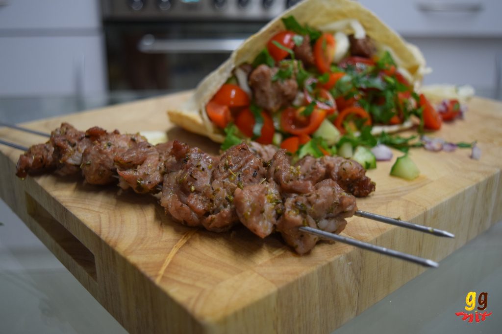 Greek pork souvlaki in a pitta with salad
